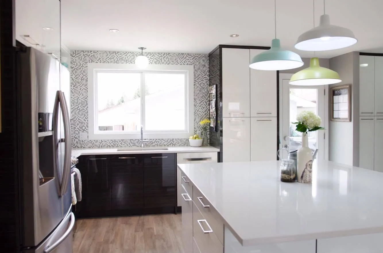 Bright renovated kitchen with pendant lighting over the island