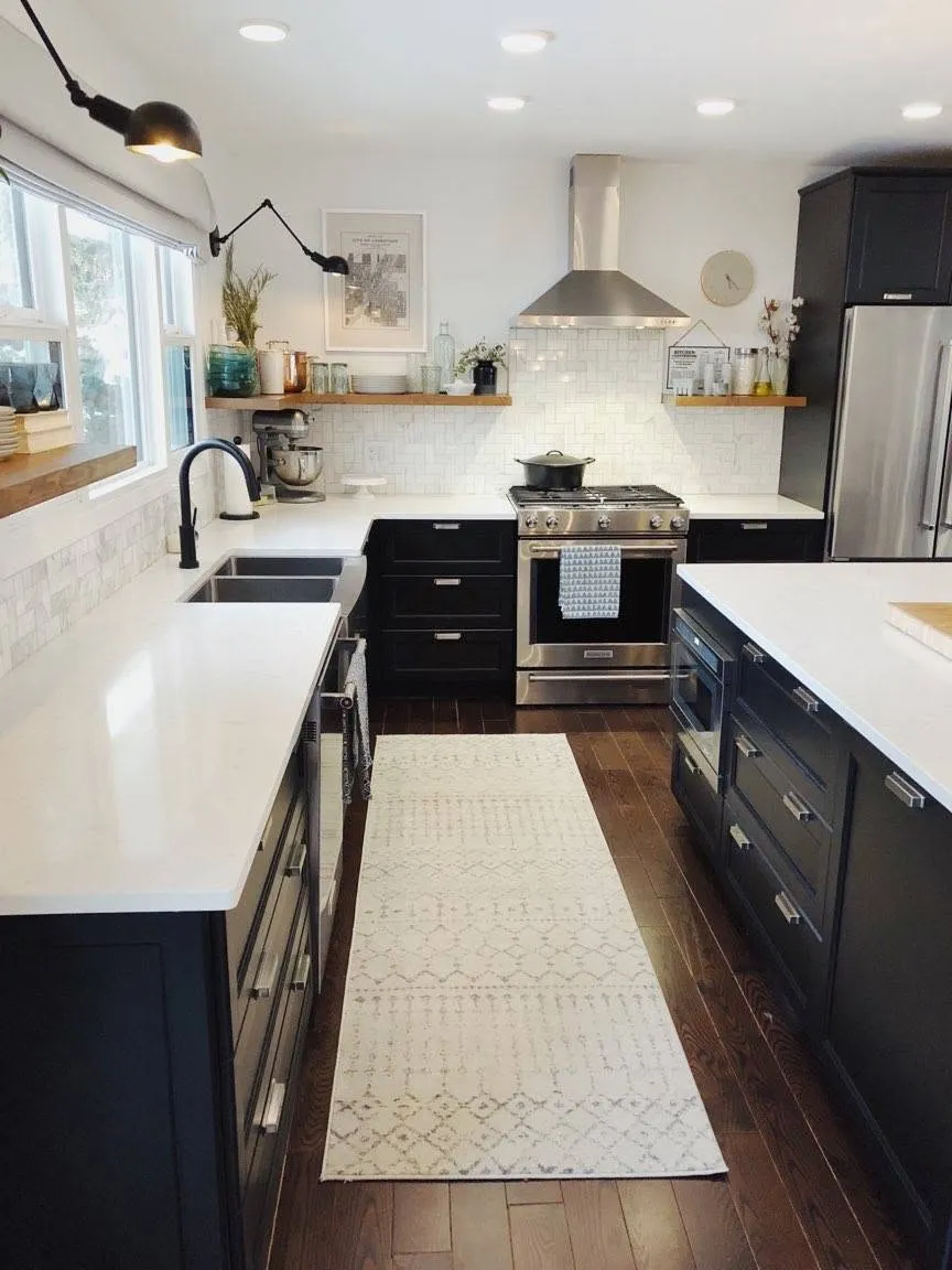 White kitchen with wall sconces and pendant lights